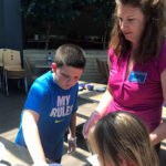 Pawlik supervises the preparation of salad dressing, with just the right blend of flavors ...
