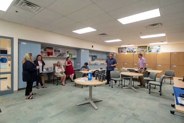 Joining staff for the meet-and-greet in the Student Organization Center are two members of the Classic Cruisers Club (at right).