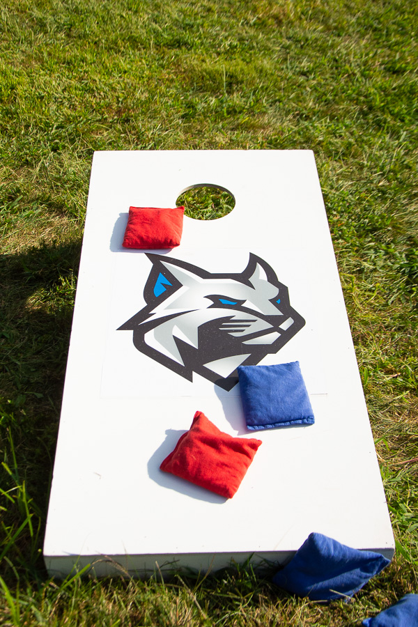 A familiar face adorns the cornhole boards.