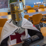 The cellphone may be out of place, but this helmeted reveler (Jonah A. Ziegler, an electronics and computer engineering technology student from Pottstown) is decidedly not out of costume.