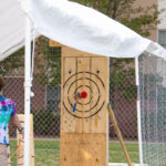 Feats of skill and dexterity include axe-throwing ...