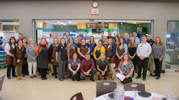Dozens of volunteer servers from offices across campus, along with Dining Services staff and members of the men's wrestling team, form an impressive crew on behalf of students.