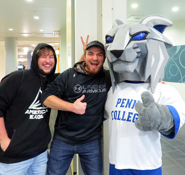 Students get into the spirit of giving, with a mascot's encouragement.