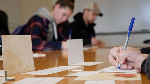 ... putting pen to notecard to share their sentiments.