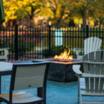 The fire pit on the Bush Campus Center patio comfortably combats the chill.