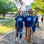 Ebersole models one of her commemorative creations, with a little help from some appropriately attired 'Student Bodies."