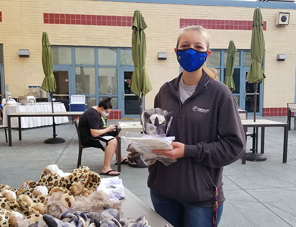 Abby E. George, a Resident Assistant and applied management major from Harrisburg, gathers all the fixin's for a crafty keepsake.