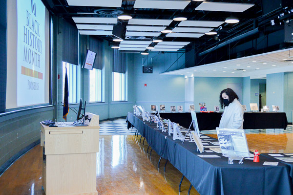 A Penn College employee spends time among the display tables.
