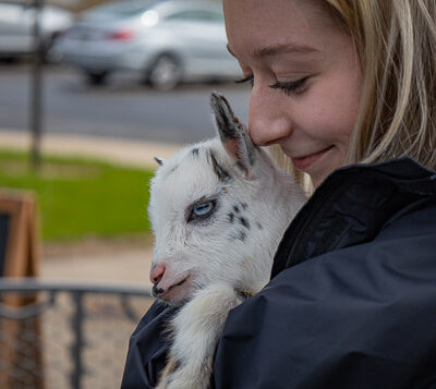 Pre-dental hygiene student Melina Kate Petrick and friend, in a photo too adorable for mere words.