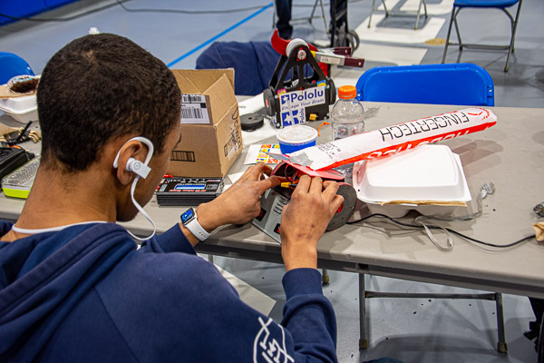 Josh James Smith, an electronics & computer engineering technology student from Whitehall, with his robot, Last Min