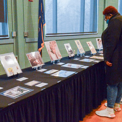 Graphic design student (and College Store work-study employee) Lisa C. Ousley, of Williamsport, takes in the exhibit.