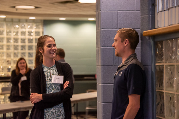 Penn College plastics & polymer technology alumni reunite and converse during a break: Sidney C. Trunzo (left), ’21, process engineer at Brentwood Industries Inc., and Nathan A. Rader-Edkin, ’20, program manager for Penn College’s Plastics Innovation & Resource Center.