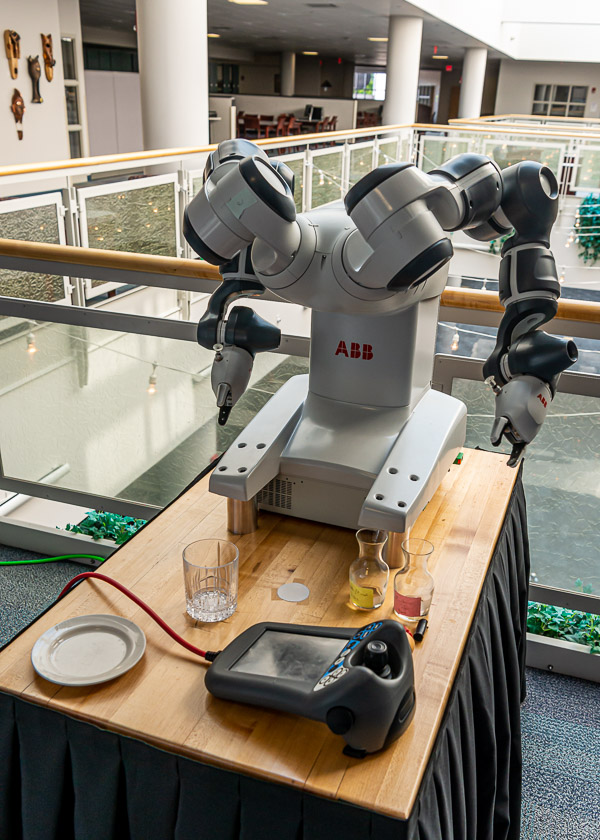 A collaborative industrial robot, with software donated by ABB, awaits interaction with guests.