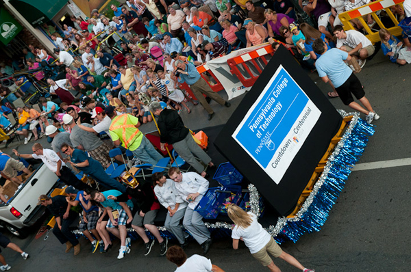 Counting down to the institution's 2014 centennial, the Penn College float travels along the parade route.