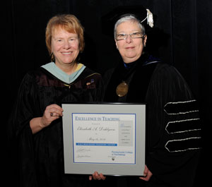 Elizabeth A. Dahlgren, Excellence in Teaching Award, wtih President Gilmour.