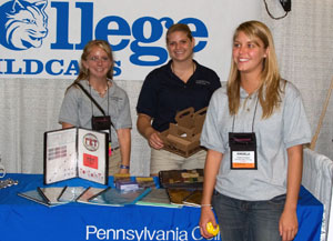 From left, Ashlyn M. Hershberger, of Hummelstown%3B Abby E. Gliem, of Biglerville%3B and Angela M. Sampsell, of DuBoistown, staff the award-winning Pennsylvania College of Technology graphic communications booth at the Flexographic Technical Association%E2%80%99s Annual Forum held in Orlando, Fla.