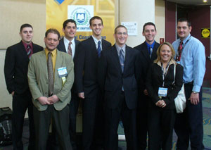 Members of Penn College's team of four-year students in national competition gather in Orlando with their advisers. From left%3A Thomas J. Wisse%3B Bernard A. 'Barney' Kahn, Penn College Construction Association adviser%3B George A. King%3B Matthew S. Divok%3B Phillip D. Hannah%3B Seth L. Culbert%3B Hilary J. Allegretto%3B and Garret Graff, co-adviser. Kahn and Graff also are instructors of building construction technology at Penn College.