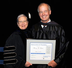 President Gilmour congratulates Harry W. Hintz, Excellence in Teaching Award recipient.