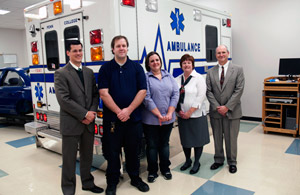 Commemorating the creation of a Pennsylvania College of Technology scholarship honoring the memory of William E. Henry are, from left, Mark A. Trueman, director of the college's paramedic technology programs; Henry's son, Matthew; his daughter, Linda Patrick; his fiancée, Kelle Johnson; and Barry R. Stiger, vice president for institutional advancement.