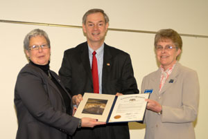 Rep. Matt Baker presents a State House of Representatives citation to Penn College President Davie Jane Gilmour, left, and Brenda G. Abplanalp, director of North Campus outreach services.