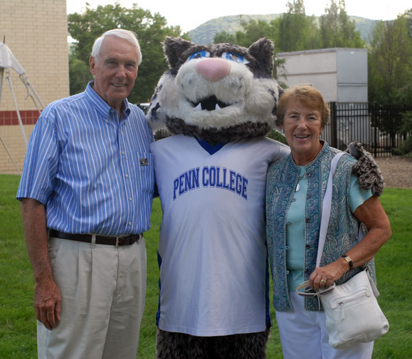 College Board of Directors Chairman Robert E. Dunham and his wife, Maureen, enjoy the festivities with the Wildcat mascot.