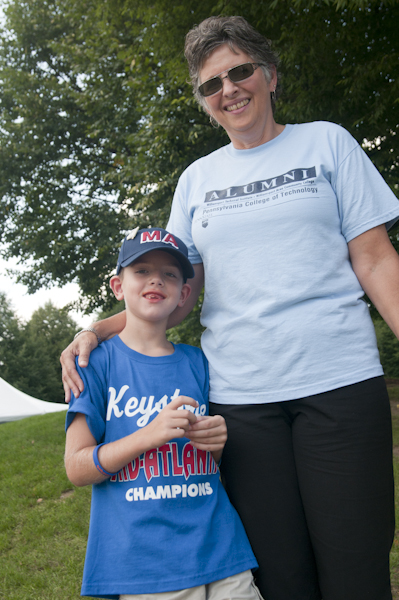 Hospitality Sales Manager Linda J. Miller roots for her hometown team with her grandson.