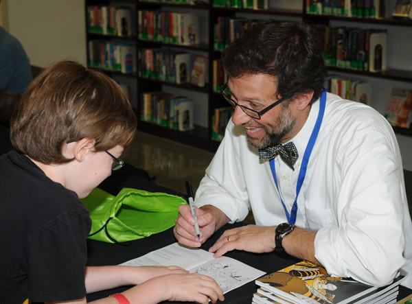 Jay Hosler, who combines the art of science and comics, clearly captivates a young fan.