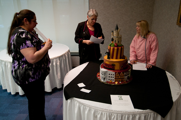 Enjoying their difficult task are, from left, judges Penn College alumna Jennifer Eckert; Kim Morrison, who has won multiple national honors for her wedding cakes; and Tammie Holsinger, who owns a party-supply store and conducts her own cake competitions.
