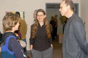Featured artist Warren Linn talks with Kristina Snook-Kohr, left%3B and Penny Lutz, gallery assistant, during his exhibit's opening Nov. 2.