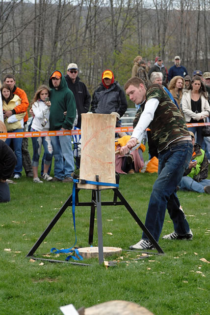 Matthew A. Daubert, chosen to participate in the stamina-testing Stihl Timbersports Collegiate Challenge, takes a healthy swing in one of the contest's four events.