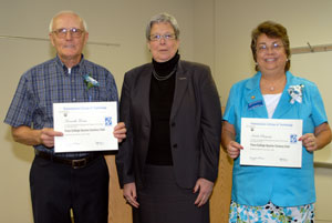Davie Jane Gilmour, Penn College president, center, presented %E2%80%9CQuarter Century Club%E2%80%9D certificates to Kenneth J. Knaus, building maintenance worker at the North Campus, and Linda D. Cheyney, secretary to the director of North Campus outreach services, to commemorate their 25 years of employment at Penn College and its predecessor Williamsport Area Community College.