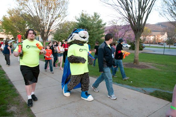 Members of the Gamers' Guild carry Nerf guns to defend the Wildcat from zombie attack during Friday's costume parade from the Bush Campus Center to the Field House.