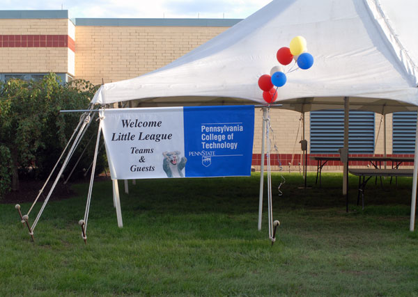 A sign outside the food tent welcomes the world to Williamsport  and Penn College.