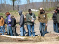 Lab assistant Erich R. Doebler (off camera) points out to interested students a harkberry log
