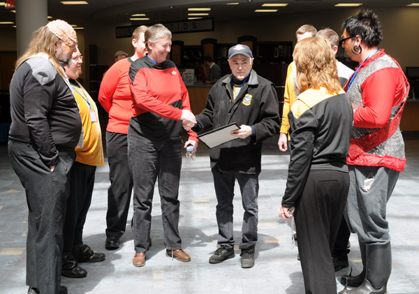 Members of the USS Susquehannock Starfleet Chapter, who later would serve as escort during closing ceremonies, give a hero's welcome to Walter Koenig.