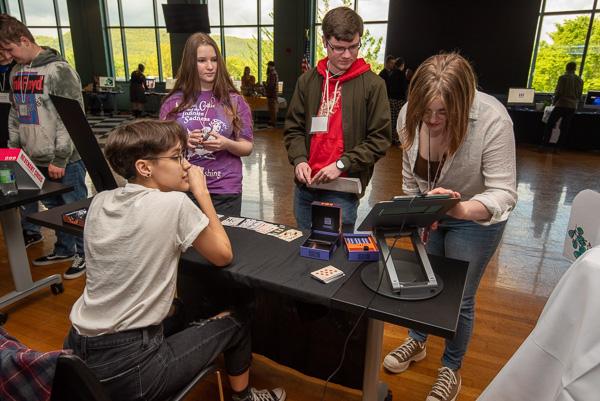In Penn’s Inn, tour guide Mckenna Jo Gardner (at right), a graphic design junior, leads two Montgomery students on an exploration of Elise A. Miller’s senior project display. 