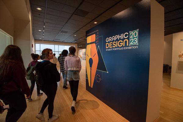 The tour winds its way through The Gallery at Penn College to see “Graphic Design 2023.”