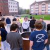 students gathered around fire pit