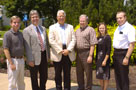 From left are Jim Shillenn, executive director and CEO of the Industrial Modernization Center; Tim Weston, assistant professor of plastics technology; Frank Sorg, director of the Pennsylvania Plastics Initiative; Larry L. Michael, executive director, workforce and economic development for Penn College; Rikki Riegner, program manager for the IMC; and Hank White, director of the college?s Plastics Manufacturing Center.