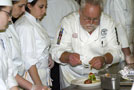 Staib demonstrates for students how to assemble the third course for the Visiting Chef Dinner on Saturday