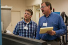 Addison Hammer, left, of Quadrant Epp USA Inc. in Wytheville, Va., joins James Womack, of Ascend Performance Materials in Pensacola Beach, Fla., in tracking measurements on the extruder