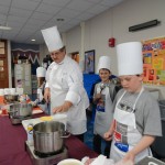 Chef Paul Mach enlists fifth-graders’ help for a cooking demonstration to kick off a week of learning at Rommelt Elementary School