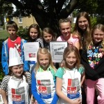 The top three winning groups show off the menus for their restaurants: The Rings of Saturn, It’s Pouring Pastries and The Soccer Experience