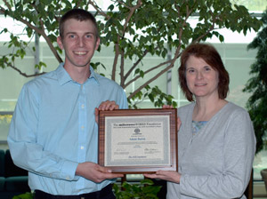 Adam W. Borek, of Muncy, receives a $1,000 tool scholarship from Mary A. Sullivan, dean of natural resources management at Penn College. Adam W. Borek, of Muncy, receives a $1,000 tool scholarship from Mary A. Sullivan, dean of natural resources management at Penn College.