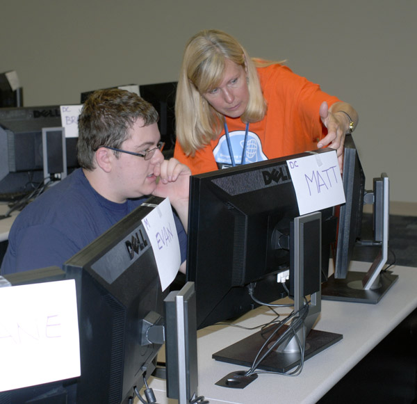 A student gets one-on-one assistance from Anita R. Girton, assistant professor of computer information technology.