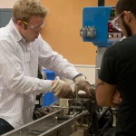Penn College student Samuel R. Scheide, of York, makes equipment adjustments