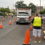 A student crew maneuvers an ambulance through traffic cones west of the Klump Academic Center.