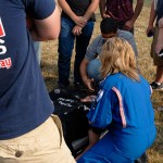 A Penn College student volunteers to be a patient, secured to a stretcher ...