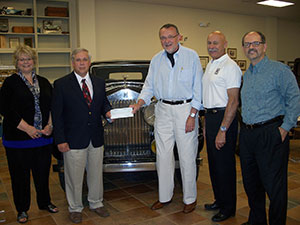 From left, Debra M. Miller, director of corporate relations for Pennsylvania College of Technology; Colin W. Williamson, dean of transportation technology; Charles Jensik, chairman of the Rolls-Royce Foundation; James Facinelli, foundation vice chair; and Timothy Younes, executive director of the Rolls-Royce Club of America.