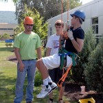 Justin Shelinski, laboratory assistant for horticulture (in orange hard hat), crosses all the t's for tree-trimming safety.